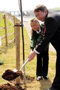 Jessica Strutt and Paul Clark plant the tree