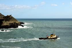 Tug boat and HMS Somerset