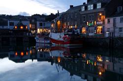 Christmas lights reflecting in Padstows inner harbour