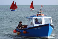 Sailing out into Looe Bay