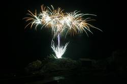 Polperro fireworks over Peak rock and the harbour