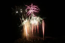 Polperro fireworks over Peak rock and the harbour