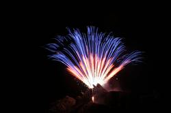 Polperro fireworks over Peak rock and the harbour